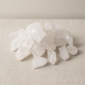 Rough milky quartz chunks piled on cotton canvas