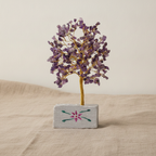 Small amethyst chipstone tree on a hand-painted stone base, on rumpled linen