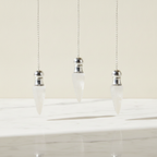 Three clear quartz pendulums with silver caps hanging from fine chains - view 2