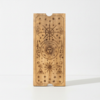 Engraved celestial lid of the four section tarot box, with sun, moon and star designs