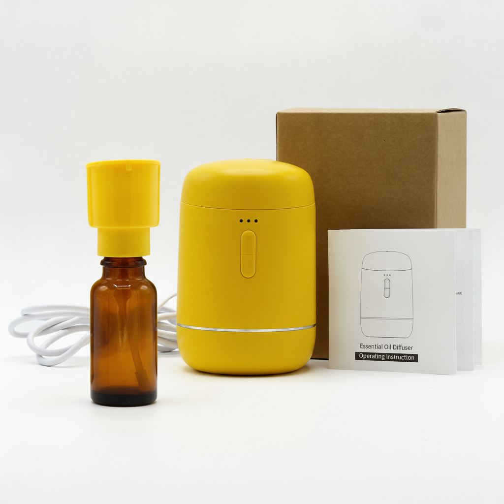 Yellow waterless diffuser with amber oil bottle, USB-C cable, box and instruction leaflet