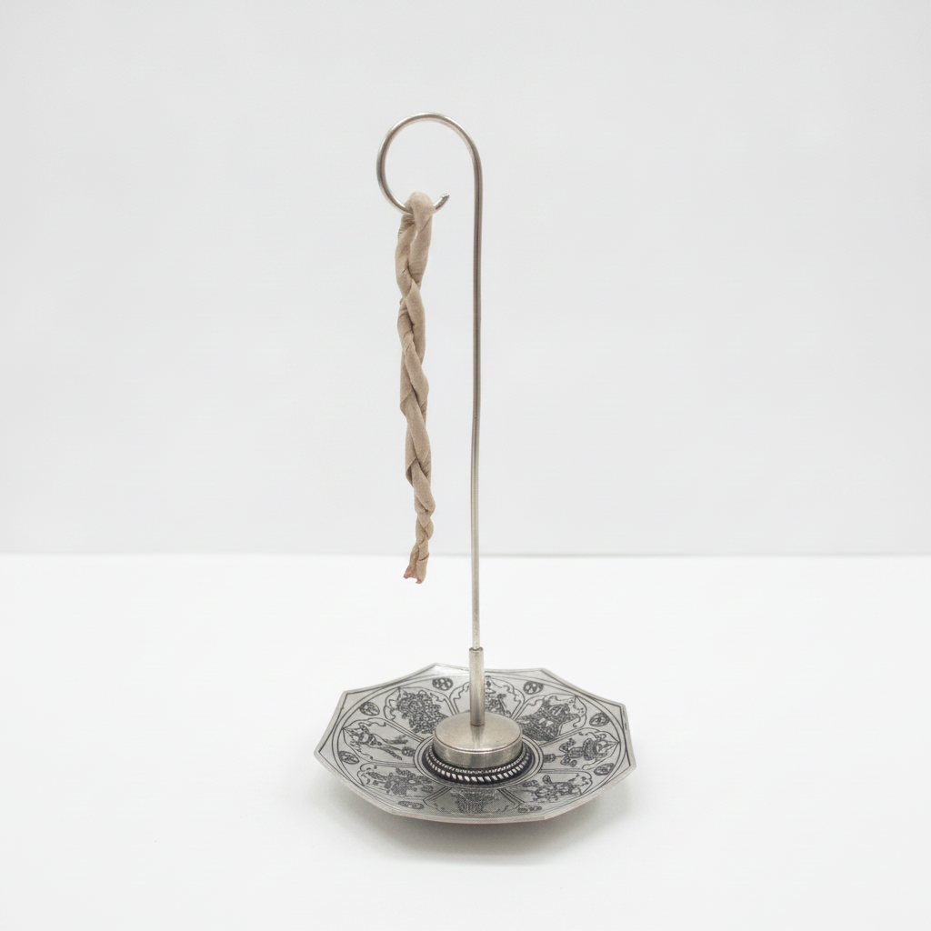 Astamangal rope incense burner, a twisted rope hanging from the hook over the octagonal dish