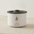 White volcano flame aroma diffuser with a textured dark lid, on cotton canvas - view 5