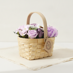Lilac and purple soap roses in a woven wicker basket with a tag, on cotton-rag paper - view 3