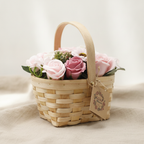 Pink and blush soap roses in a woven wicker basket with a tag, on rumpled linen - view 3