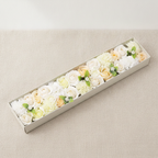 Long box of white and ivory soap roses lying open on cotton canvas - view 7
