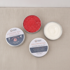 Dark self-care kit box lying flat and closed on rumpled linen - view 6