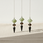 Three pendulums in green aventurine, tiger eye and black agate hanging side by side - view 3