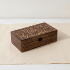 Carved mango wood box open to show the grid of 32 bottle compartments - view 3