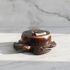 Coconut shell turtle kalimba on a marble table