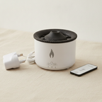 White volcano flame aroma diffuser with a textured dark lid, on cotton canvas - view 7