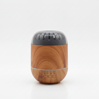 Wood effect ultrasonic essential oil diffuser on a white surface