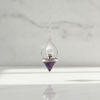 Lantern of Life amethyst pendulum hanging in daylight