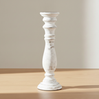 Whitewash mango wood pillar candle holder on a pale oak table