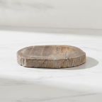 Petrified wood stone soap dish on a marble worktop